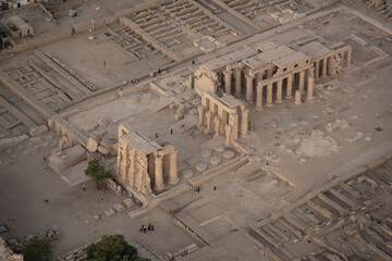 ancient temples at sunset in Luxor, Egypt, showing the remains of historical structures and rich heritage