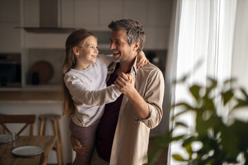 Fototapeta na wymiar Father and daughter dancing together joyful moments