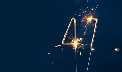 47 years anniversary celebration festive background made with Bengal fires in the form of number Forty seven.