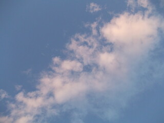 gentle blue sky and soft airy white clouds