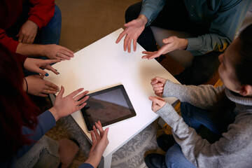 People discussing screen tablet during mental support session. Concept of digital therapy tools, mental health programs, burnout recovery, guided discussion, tech counseling, emotional support.