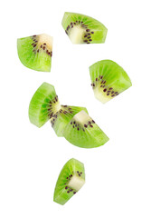 Peeled triangular kiwi slices fall through space. Isolated on white.