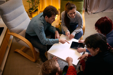 Group members discussing info on tablet during mental support meeting. Concept of digital therapy tools, guided discussion, mental health programs, burnout recovery, technology assisted support.