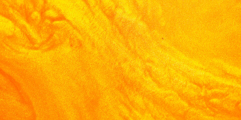 Shimmering gold abstract background. Liquid gold texture waves and swirls. Beautiful shiny yellow...