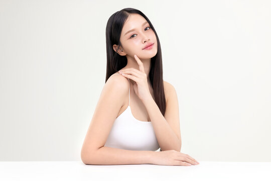 Portrait beautiful young Asian woman with K beauty style makeup and perfect skin on isolated white background. Facial and skin care concept for commercial advertising.