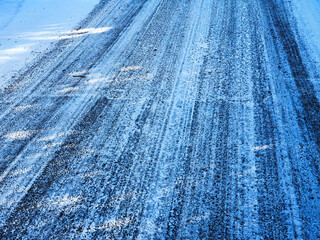 country rural road covered with ice snow and frost