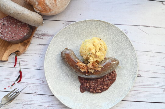 Traditional Czech sausages including jitrnice and jelita, displayed as part of authentic Czech cuisine, highlighting rustic meat specialties.