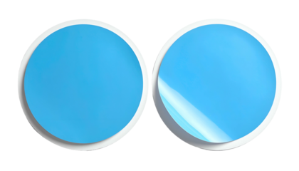 Two adjacent blue circular labels with white borders, one with peeled corner