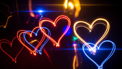 A dynamic composition of multiple glowing neon hearts in red and blue, with musical notes and light flares. A vibrant and energetic design for a party or celebration.