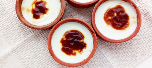 Traditional turkish dessert bakery rice pudding Turkish name Fırın Sutlac in glass bowl