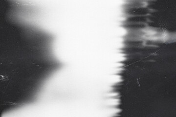 light leaks,grunge black and white film background,retro film overlay effect with scratch dust and ray,retro grain noisy film distressed texture light leak flare on black background,old film light