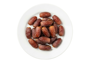 dried dates on white plate close up still life