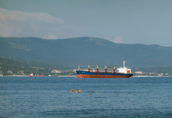 August 24, 2025: Large cargo ship entering the port of Novorossiysk, Russia, on the Black Sea, illustrating maritime transport, industrial shipping and coastal infrastructure