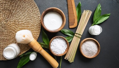 white powder natural ingredients flatlay minimalist spa beauty organic skincare bamboo brushes dark slate background