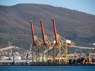 August 22 2025 View of Novorossiysk port Russia with cargo ships and cranes on the coastline. Industrial maritime scene on the Black Sea