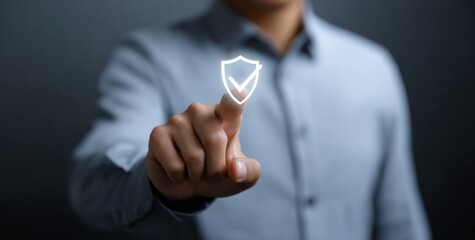 Asian male touching digital shield icon for cybersecurity concept