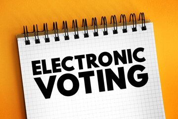 Electronic Voting is voting that uses electronic means to either aid or take care of casting and counting ballots, text concept on notepad