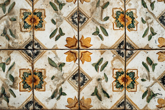 antique ceramic tiles with floral patterns and vine motifs