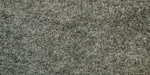 The texture of the wool felt is dark gray, smooth and even.