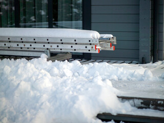 telescopic ladder abandoned on the snow