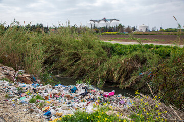 shredded and pressed recyclable plastic waste that has been burned and causes environmental pollution.