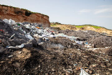 shredded and pressed recyclable plastic waste that has been burned and causes environmental pollution.