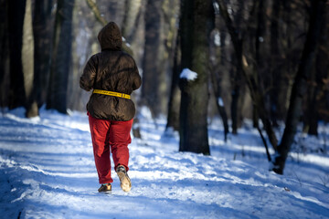 woman walking in winter forest