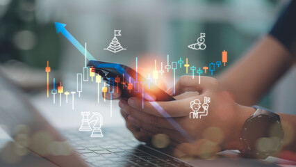 Business person analyzing stock market data on mobile phone. Concept of financial investment, trading strategy, forex growth, digital economy, and successful portfolio management.