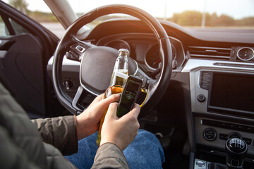 Female In Driver's Seat With Beer And Alcohol Tester. Highlighting Dangers Of Drinking And Driving.