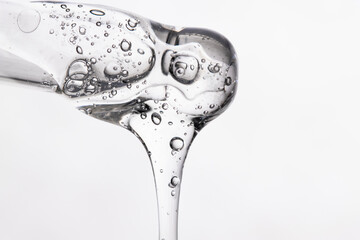 A close-up of a hyaluronic acid dropper. The transparent acid is used for body hydration