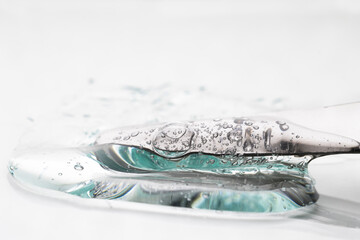 A close-up of a clear liquid gel with bubbles. A cosmetic product for moisturizing and firming