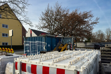 Construction work in a urban area with equipment and barriers