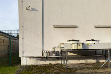 Air conditioning units on the wall of a commercial building
