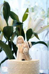 white wedding cake with floral decor, elegant wedding reception table, romantic celebration concept, classic bridal cake centerpiece, wedding cake, cake