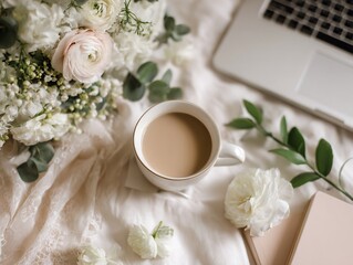 Cozy Morning Flat Lay with Coffee, White Ranunculus, Laptop, and Journal on Soft Fabric