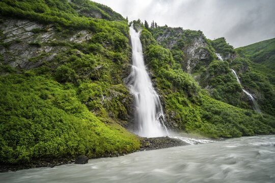 Horsetail Falls waterfall on the Lowe River in a green gorge, long exposure, Keystone Canyon, Richardson Highway, Alaska, USA