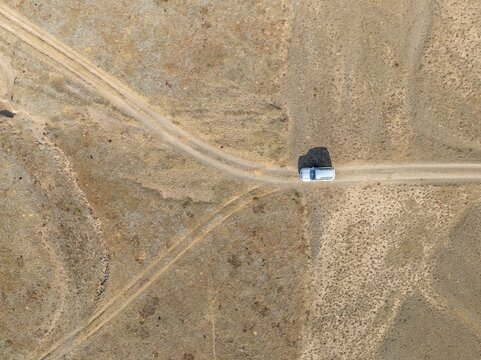 Aerial view, Vast empty landscape, Road and off-road vehicle, Top down view, Two paths divide, Symbolic for decisions, Moldo Too mountains, Naryn region, Kyrgyzstan