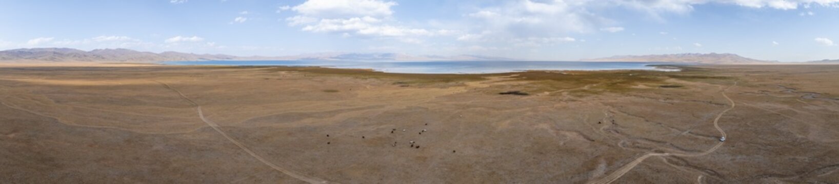 Aerial view, Vast empty landscape at the mountain lake Song Kul in autumn, Moldo Too Mountains, Naryn region, Kyrgyzstan