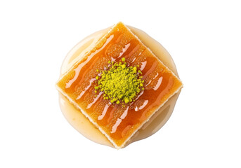 pistachio caramel tart with orange glaze on round pastry