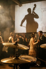 Vintage jazz party with dancing couples in retro ballroom, smoky ambience, drum set in foreground and large shadow of double bass player on wall, elegant 1920s style celebration, music and dancing