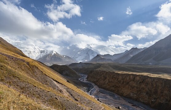 Valley with river Achik Tash between high mountains, mountain landscape with glaciated peak Pik Lenin, Trans Alay Mountains, Pamir Mountains, Osh Province, Kyrgyzstan