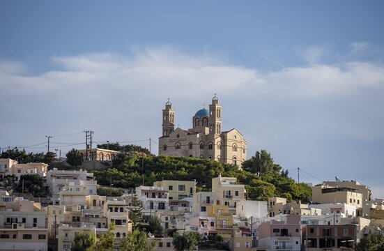 View of the town of Ermoupoli with pastel-coloured houses, on the hill Anastasi Church or Church of the Resurrection, Syros, Cyclades, Greece