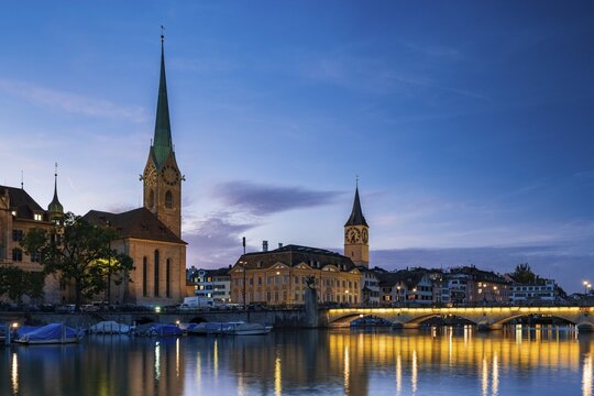 Fraum&uuml;nster and St. Peter's Church at dusk, River Limmat, Old Town of Zurich, Canton Zurich, Switzerland