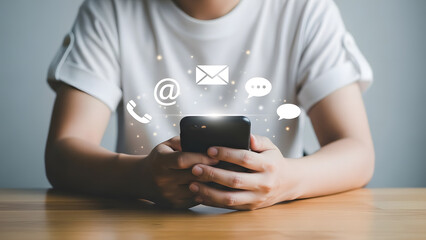 Person Holding Smartphone with Digital Communication Icons for Online Contact and Global Connectivity