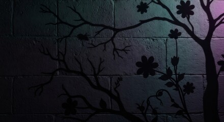 Silhouettes of trees flowers and a spider on a textured wall with greenblue to purple lighting