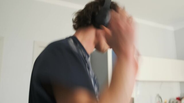 energetic dance session man dancing in casual kitchen dynamic man danc