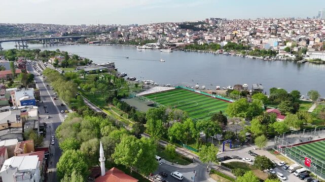 Aerial pan shot of a football pitch on the Golden Horn coast in Istanbul