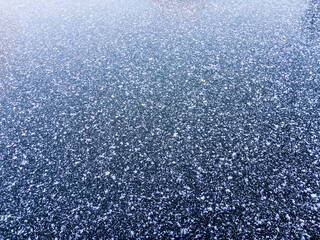 Fresh snowfall on a frozen canal