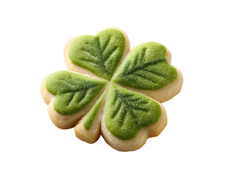 A delightful four leaf clover shaped cookie with green icing and sugar sprinkles
