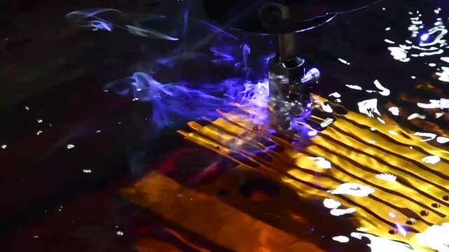 Electric stitching machine, erosion, metal cutting in liquid.  The electroerosion cutting machine cuts out metal parts. 